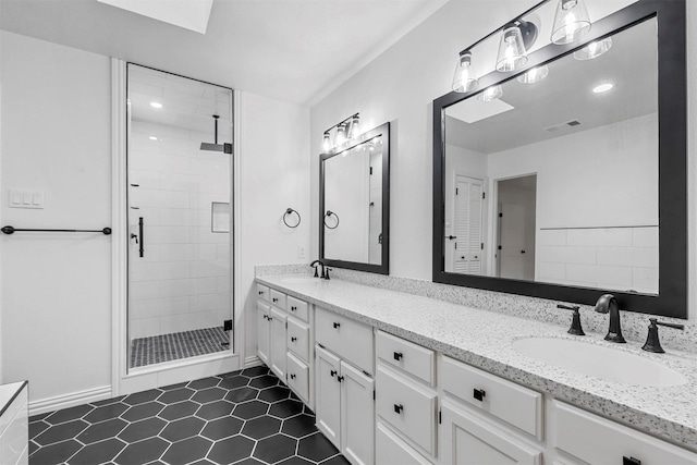 bathroom with an enclosed shower and vanity