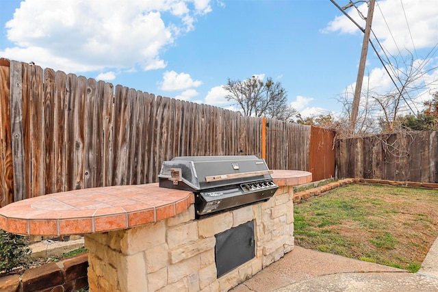 view of patio with a grill and area for grilling