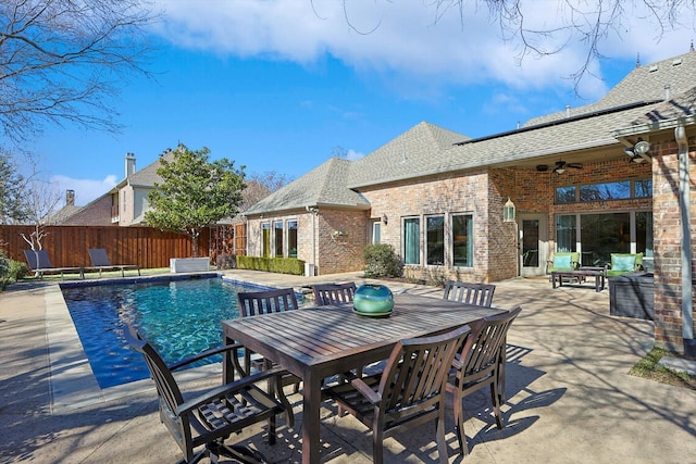 view of pool featuring ceiling fan and a patio