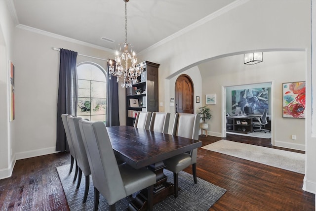 dining area with a notable chandelier, crown molding, and dark wood-type flooring