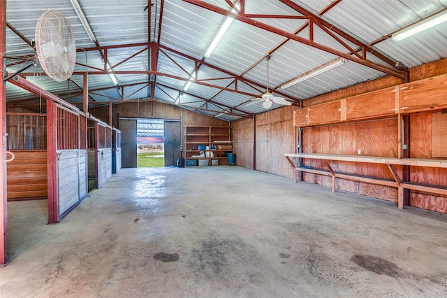 garage featuring wood walls