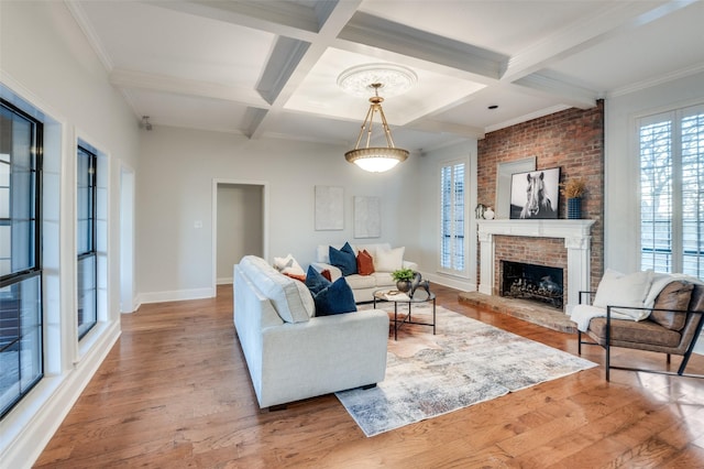 living room with coffered ceiling, light hardwood / wood-style flooring, and beamed ceiling