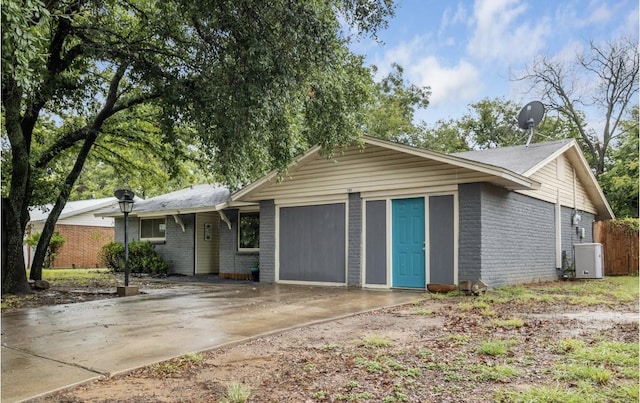 ranch-style house featuring a garage