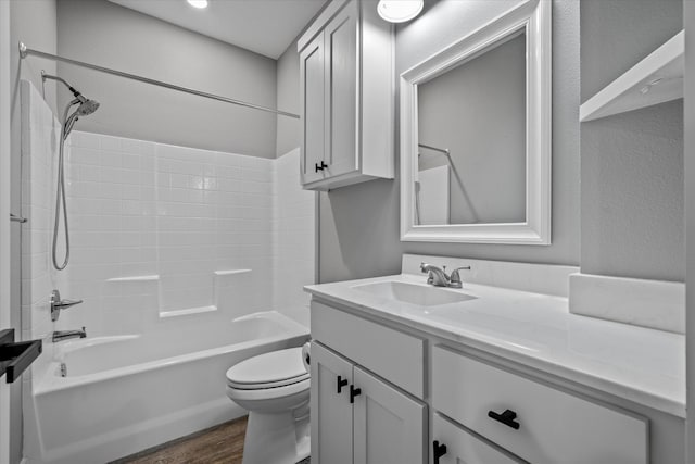 full bathroom with vanity, toilet, shower / washtub combination, and wood-type flooring