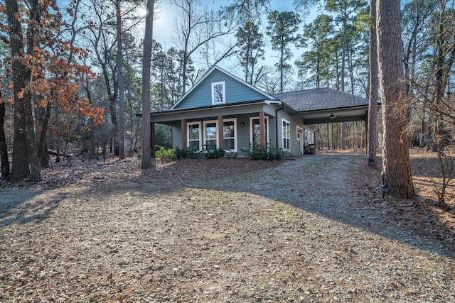 view of front facade featuring a porch and a carport