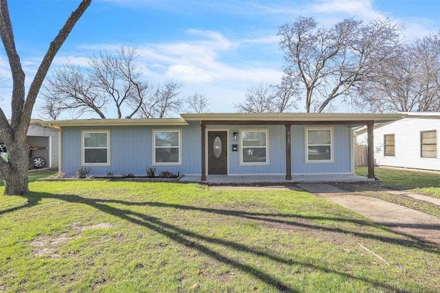 ranch-style home with covered porch and a front lawn