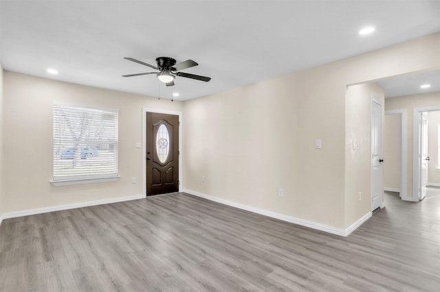 entrance foyer featuring light wood-type flooring and ceiling fan