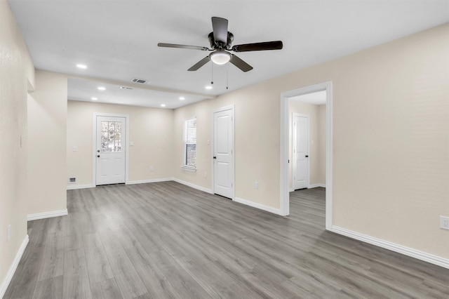 spare room with light hardwood / wood-style floors and ceiling fan