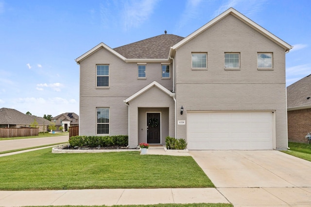 front facade featuring a front yard and a garage