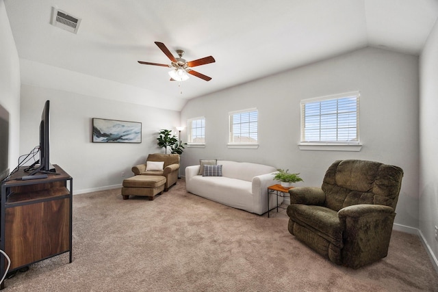 carpeted living room with ceiling fan and lofted ceiling