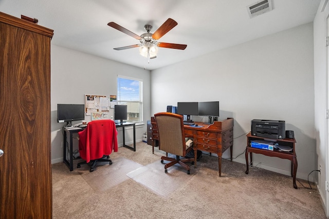 home office with ceiling fan and light colored carpet