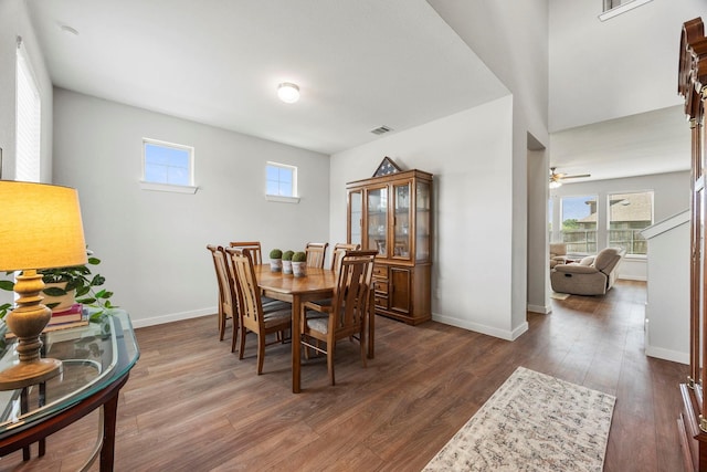 dining area with ceiling fan, dark wood-type flooring, and plenty of natural light