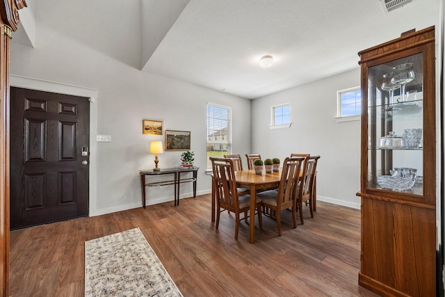 dining area featuring dark hardwood / wood-style floors