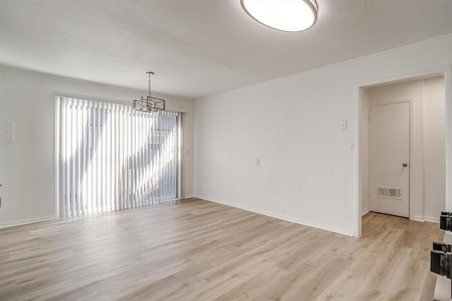 spare room featuring light wood-type flooring