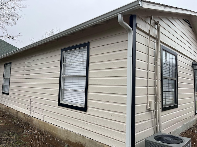 view of side of property featuring central AC unit