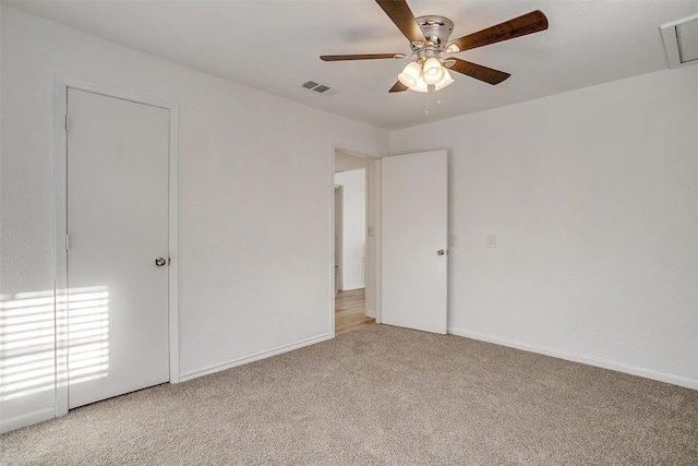 unfurnished bedroom featuring ceiling fan and carpet floors