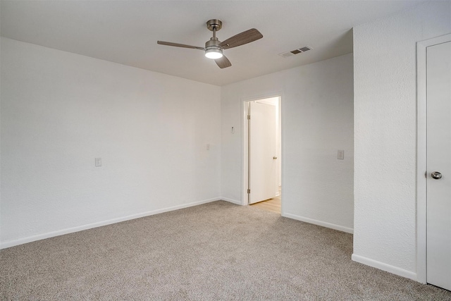 carpeted empty room with ceiling fan