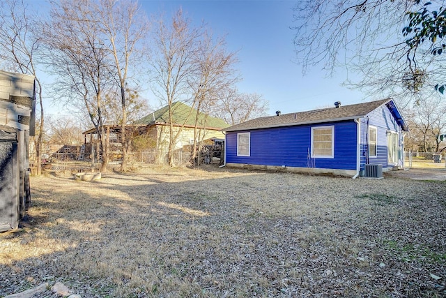 back of house featuring central AC unit