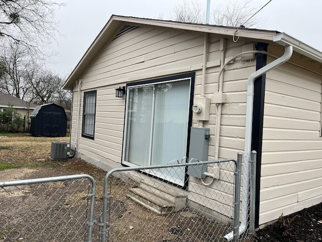 view of side of property with central AC