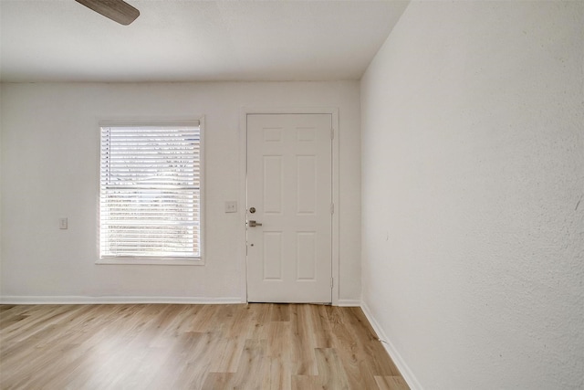 entrance foyer featuring ceiling fan and light wood-type flooring