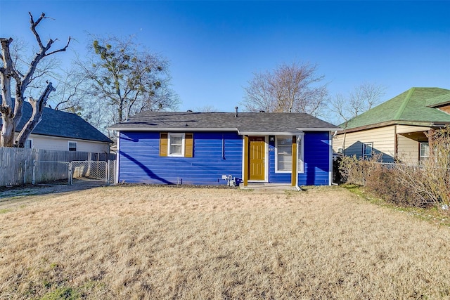 ranch-style home with a front lawn