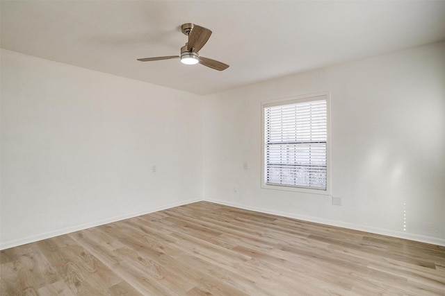 empty room with light wood-type flooring and ceiling fan