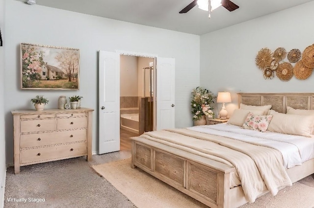 bedroom with ceiling fan and ensuite bath