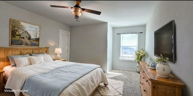 carpeted bedroom with ceiling fan