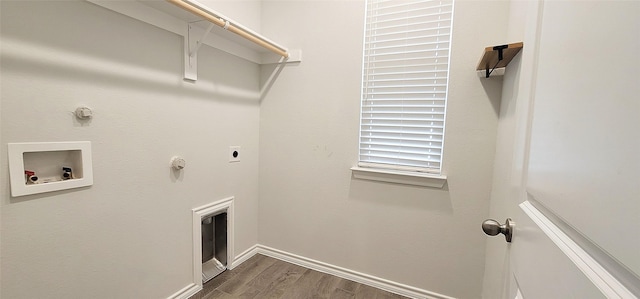 clothes washing area featuring washer hookup, hookup for a gas dryer, hookup for an electric dryer, and dark hardwood / wood-style floors