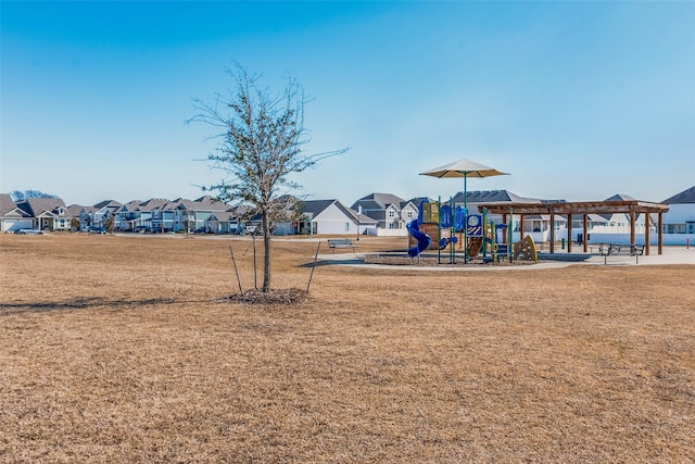 view of jungle gym featuring a lawn