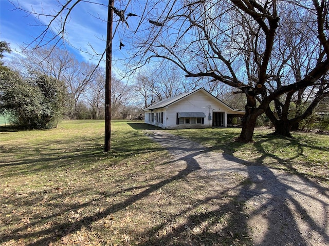 view of home's exterior featuring a lawn