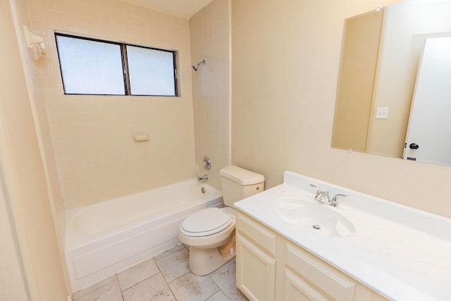 full bathroom with vanity, toilet, tile patterned floors, and tiled shower / bath combo