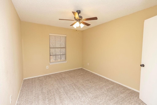 empty room featuring carpet floors, a textured ceiling, and ceiling fan