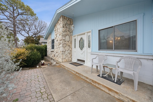 doorway to property with a patio