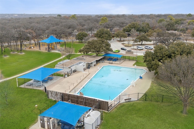 view of pool with a lawn