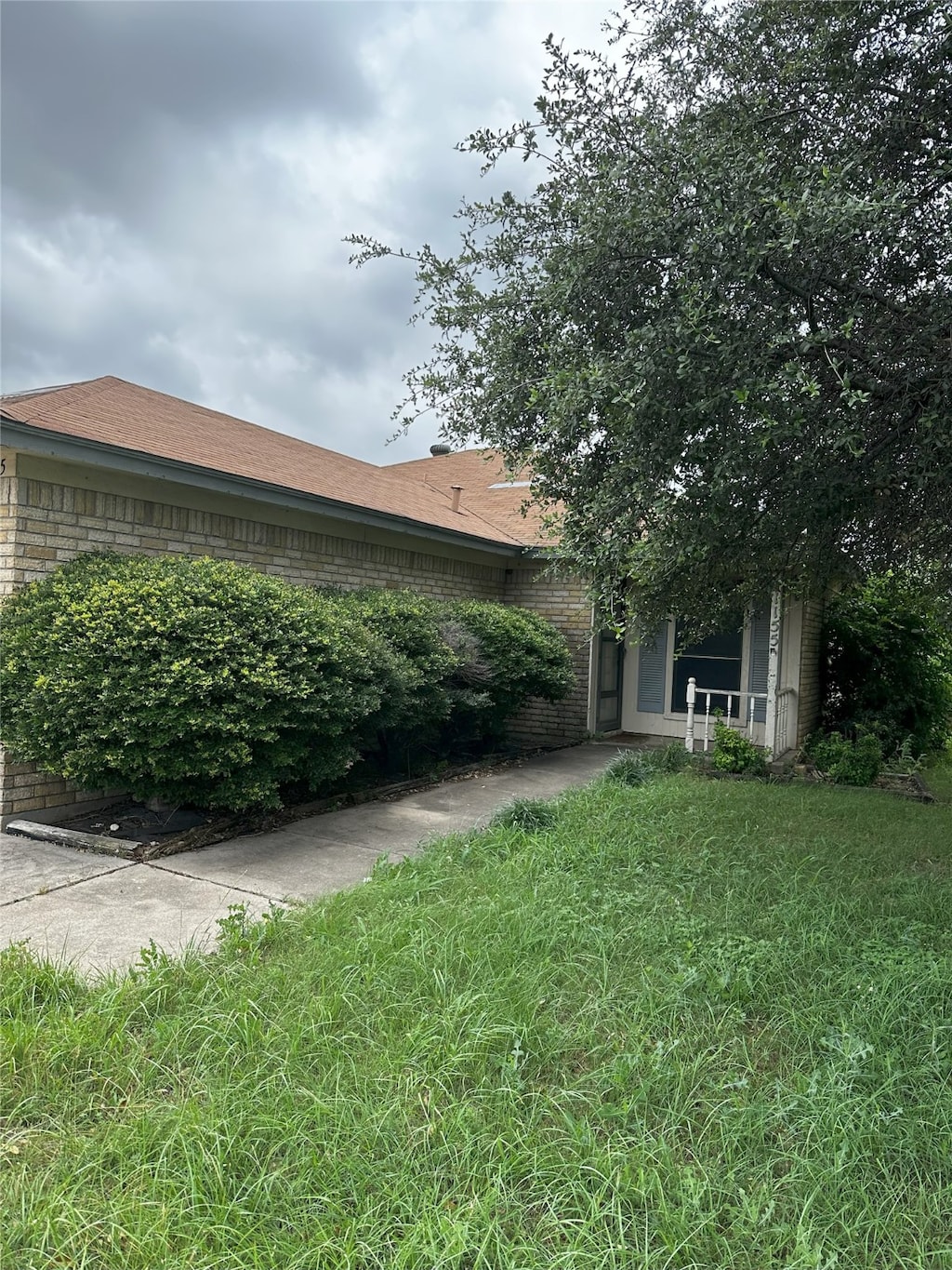 view of home's exterior featuring a yard