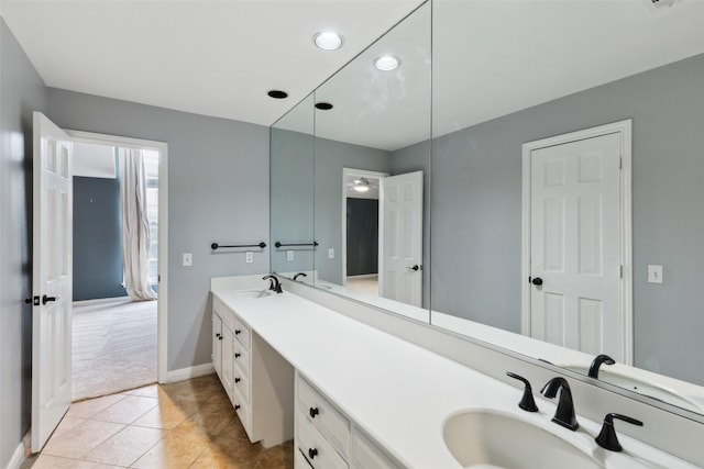 bathroom with tile patterned floors and vanity