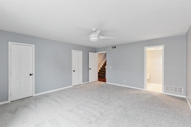 carpeted empty room with ceiling fan