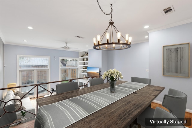 dining area featuring light hardwood / wood-style floors, ornamental molding, and ceiling fan