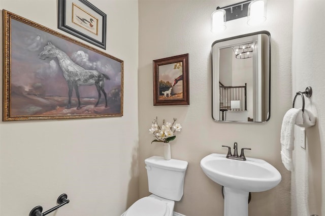 bathroom with sink and toilet