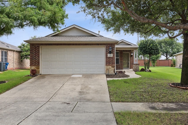 ranch-style home with a garage and a front yard