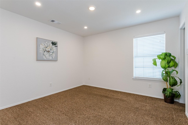 carpeted empty room with a healthy amount of sunlight