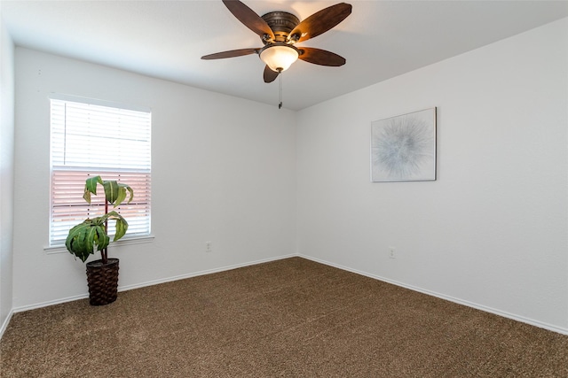 carpeted empty room featuring ceiling fan