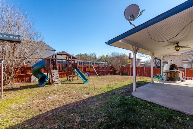 view of yard featuring a patio area and a playground