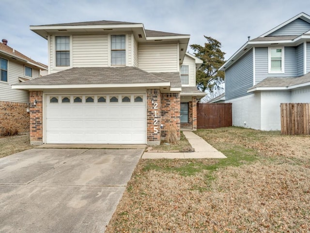 view of front property with a front yard and a garage