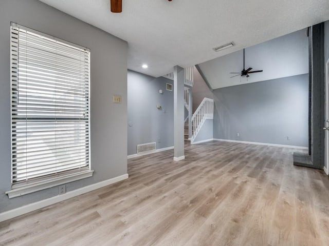 unfurnished living room with light hardwood / wood-style floors and ceiling fan