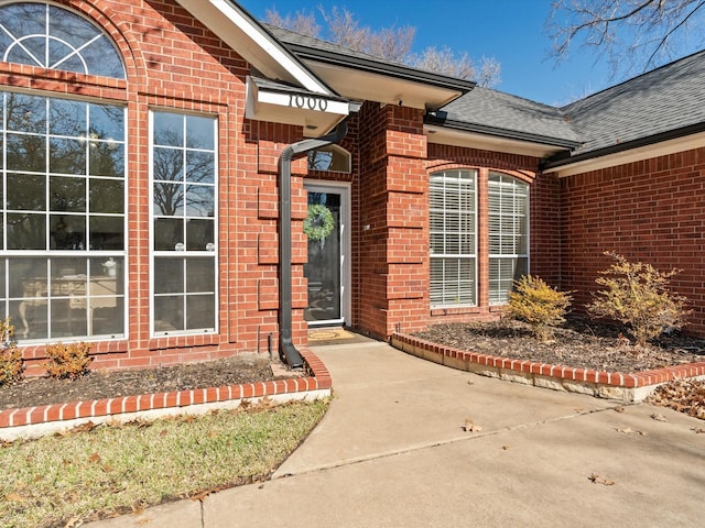 property entrance featuring a patio area