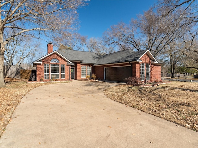 ranch-style house featuring a garage