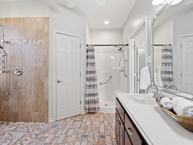 bathroom featuring vanity and curtained shower