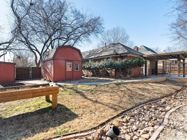 view of yard with a pergola and a storage shed